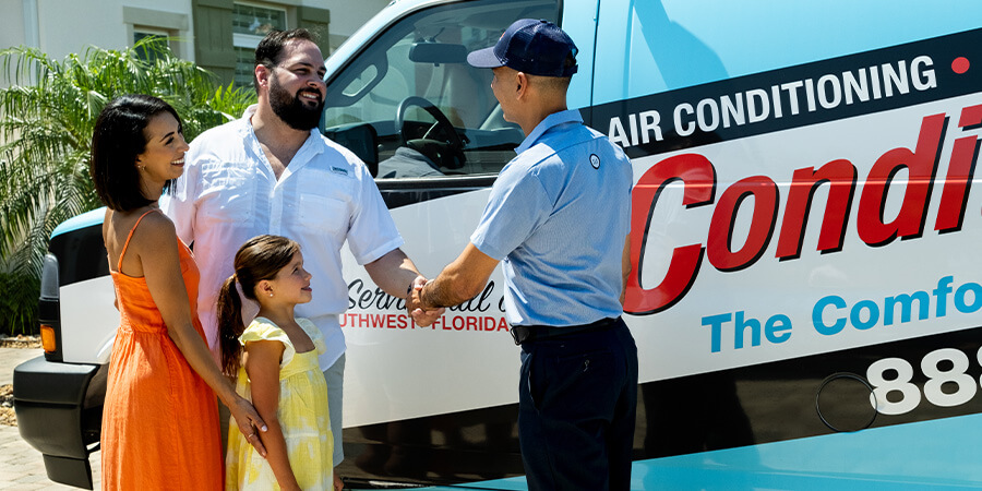 service technician shaking hands