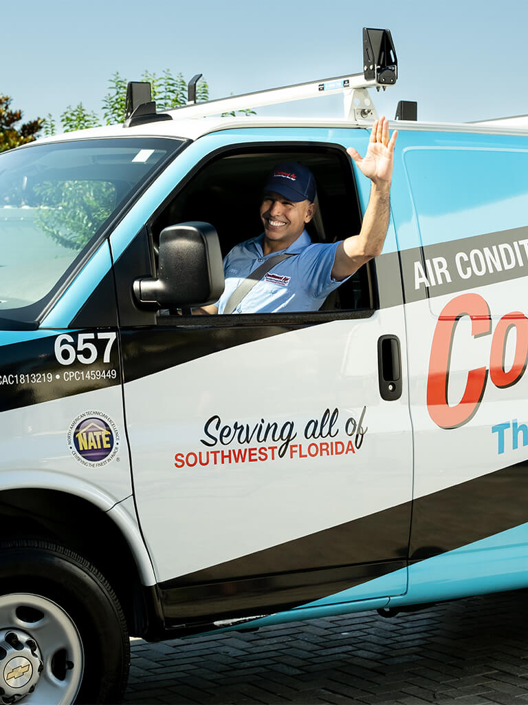 Service technician greeting homeowners